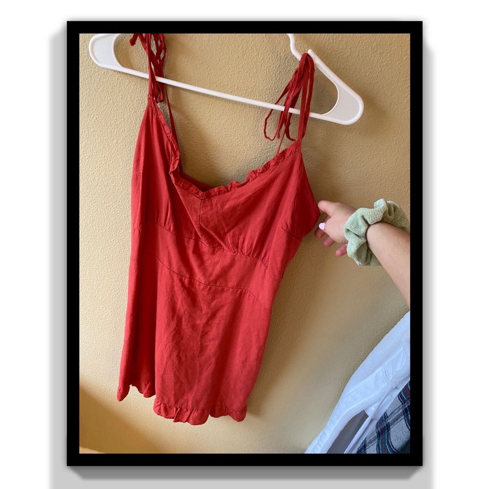 Red dress. Bow tie straps. Pockets.